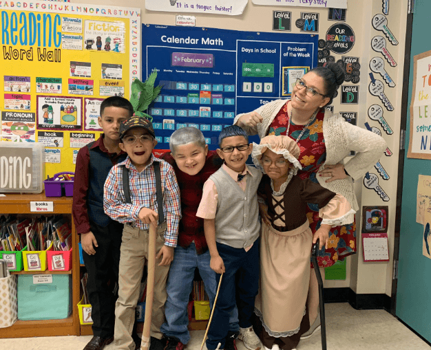 Image of Lawrence with her students dressed up as the elderly